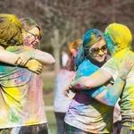 HOLI 2016 four students hugging